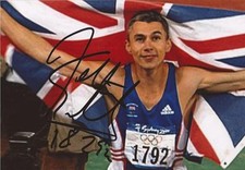 GREAT BRITAIN: JONATHAN EDWARDS SIGNED 6x4 ACTION PHOTO+COA *LONDON 2012*