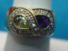 FANCY STERLING SILVER W/GOLD VERMEIL RING WITH DIA. SIMULANTS AND 2 COLOR STONES