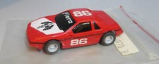 "NEW OS" TYCO 86 RED FIERO ON A HP7 CHASSIS HO SLOT CAR