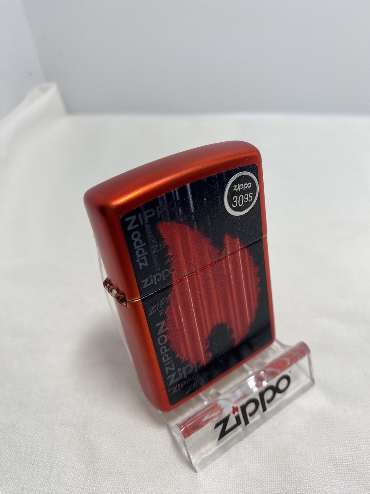 Zippo Flame Design On A Metallic Red Lighter