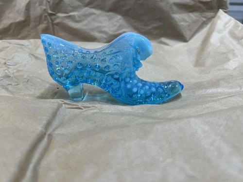 This is a vintage Fenton blue opalescent hobnail glass cat's head slipper shoe.