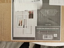 Intersecting white floating wall shelves (3)