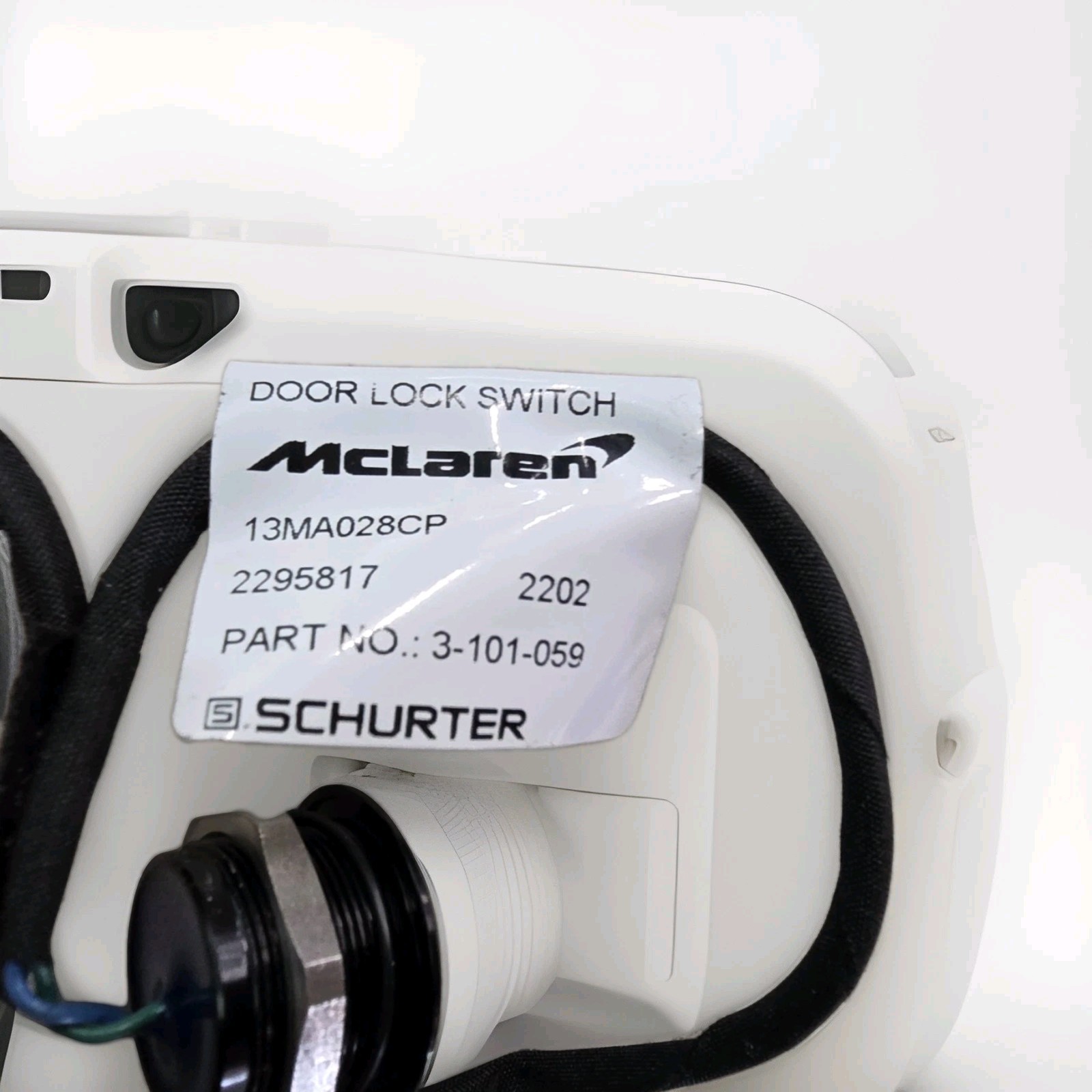 17- 23 720 McLaren 13MA028CP Left Quarter Door Lock Switch Genuine