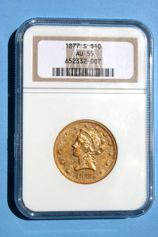 An 1877 s $10 Liberty Eagle Gold Coin, Certified NGC AU 55.