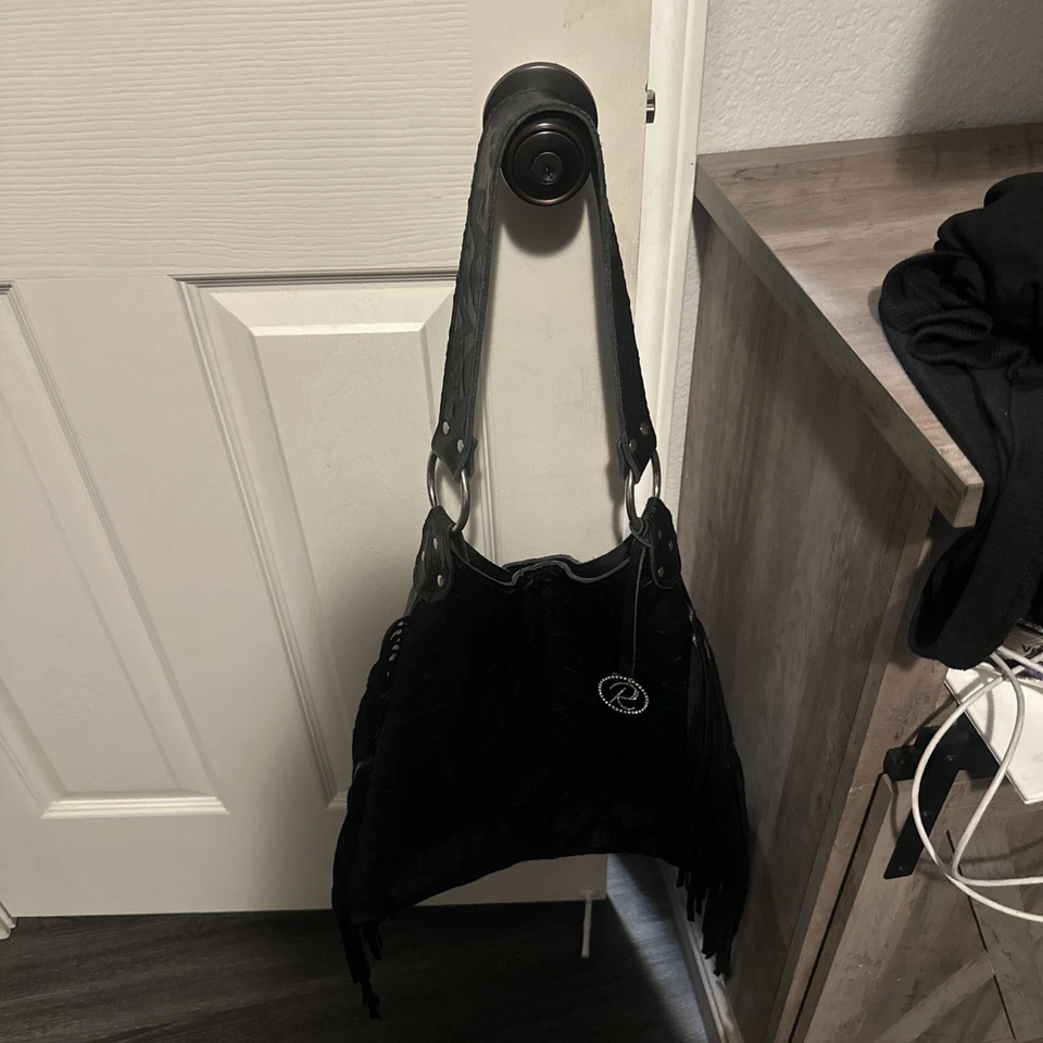 Hobo con flecos Nancy de cuero negro Raviani Foto 2 de 4