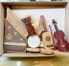 A musical set consisting of five handmade wooden musical instruments