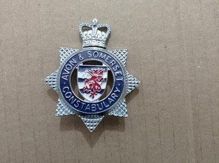 Avon & Somerset Constabulary cap badge with brass fixing