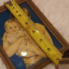 Mother Baby holding Rattle or toy  by Charlotte Becker — photo 7