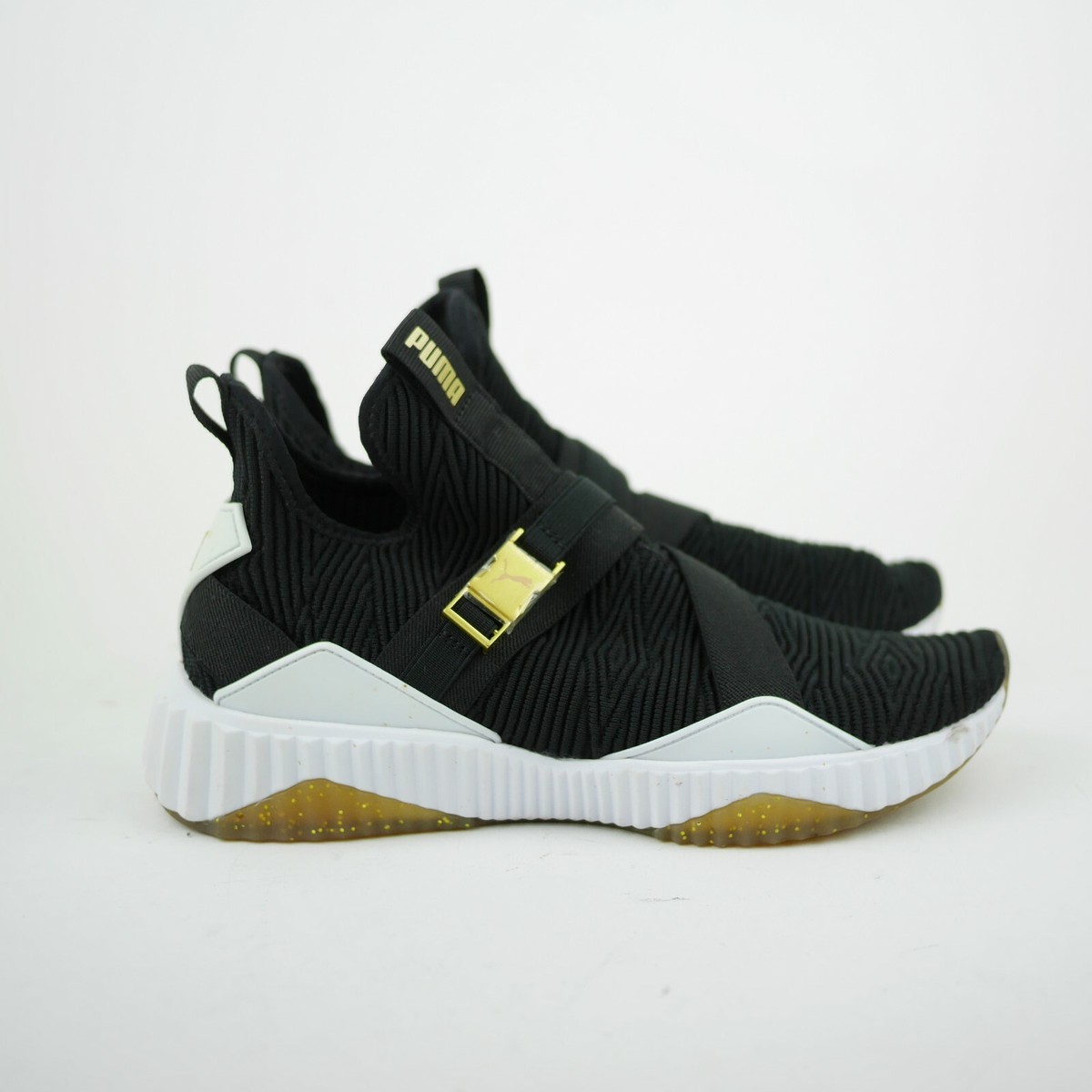 puma defy varsity black and gold