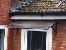 Baldacchino porta in ferro battuto, riparo sopra porta.