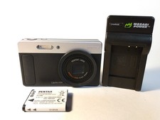 Pentax Optio H90 digital camera, works, black spot on screen, pictures good