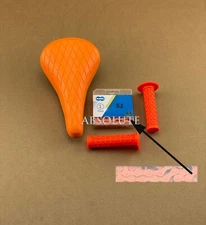 ORANGE DIAMOND STITCHED BMX BIKE SADDLE W/ BMX KMC CHAIN &TRIANGLE STYLE GRIPS. 