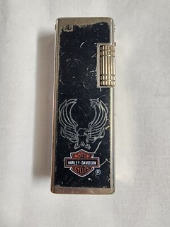 Encendedor estilo Rollalite tono dorado Harley Davidson vintage. RARO