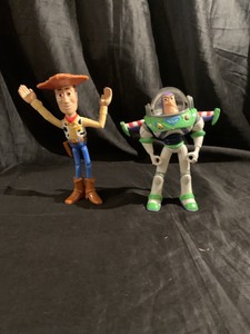 buzz lightyear holding woody