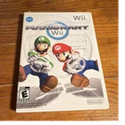 New ListingNintendo Mario Kart Wii Complete w/ manual and wiimote wheel attachment.