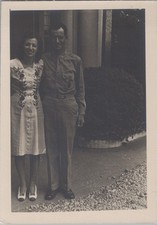 WW2 Photo of Army Officer and Woman Standing at Doorway Beside Hedge