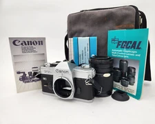 Canon FTb QL 35mm SLR Film Camera w/ Lens, Carrying Case, & Other Accessories