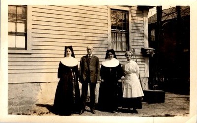 1920s Catholic Nuns Nurse Man Three Piece Suit Group Portrait Photograph