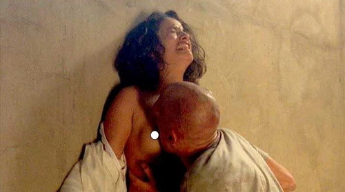 BEYOND RE-ANIMATOR DVD cover showing a man in white robes embracing a screaming woman against a beige wall.