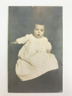 Postcard RPPC Antique Baby Infant Portrait With Gown Curious Expression c1920's
