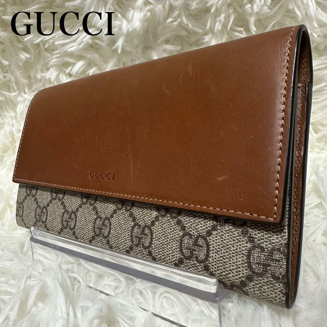 Portefeuille long GUCCI GG Supreme cuir PVC rabat marron 4233