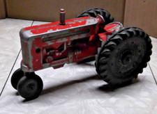 VTG CAST METAL LEE TOYS RED TRACTOR WITH BLACK WHEELS 7''L X 3 1/2'' H X 4"W