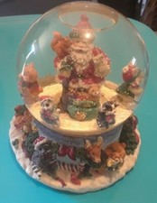 CHRISTMAS THEMED MUSICAL SNOW GLOBE WITH SANTA CLAUS AND OTHERS