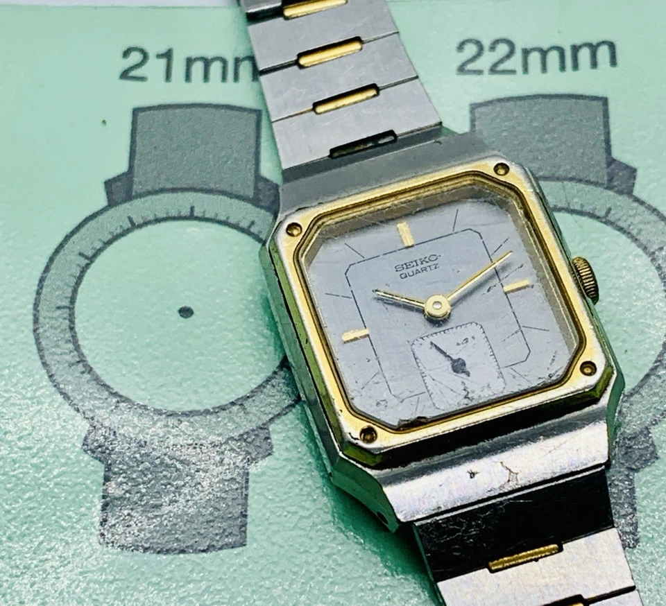 Reloj para mujer Seiko 1428-5089 tono plata/oro caja rectangular piezas/solo reparación Foto 3 de 4