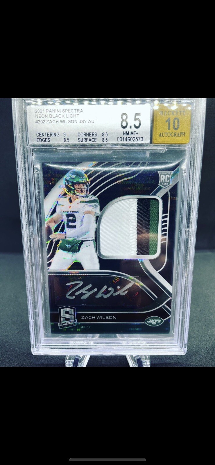 Zach Wilson Panini Spectra Radiant Rookie Patch Signatures #ZW Neon Black Light