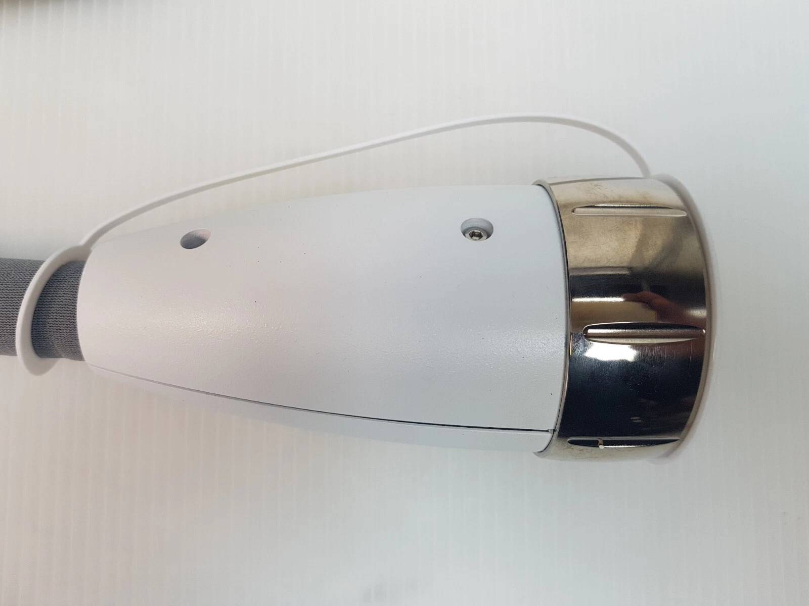 Connector housing with chrome threaded collar on the M22 Nd:YAG head