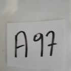 White paper with black handwritten text “A997” in bold block letters.