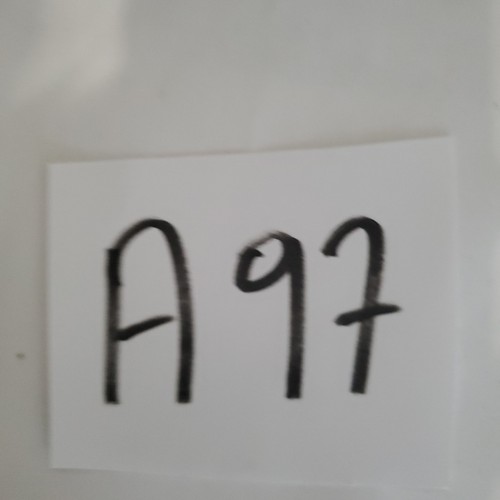 White paper with black handwritten text “A997” in bold block letters.