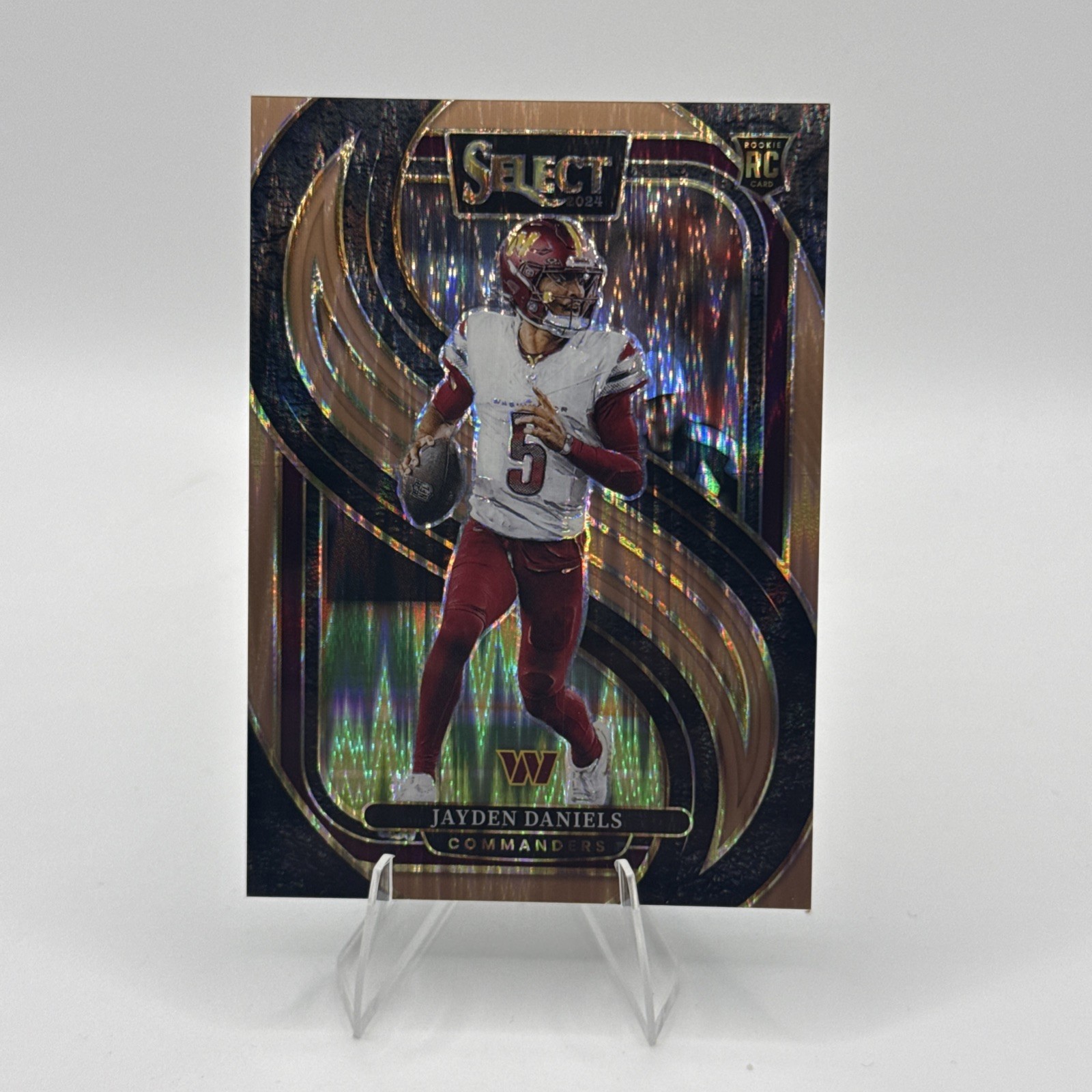 2024 Panini Select - Premier Level Jayden Daniels Copper Shock Prizm /299 (RC)