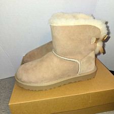 UGG Mini Bailey Bow II Suede Sheepskin Pull-O...