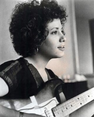 Janis Ian 1970's portrait holding guitar 8x10 inch photo