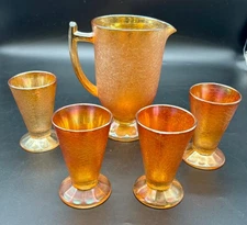 Jeanette Carnival Glass Pitcher and Four Tumblers Marigold
