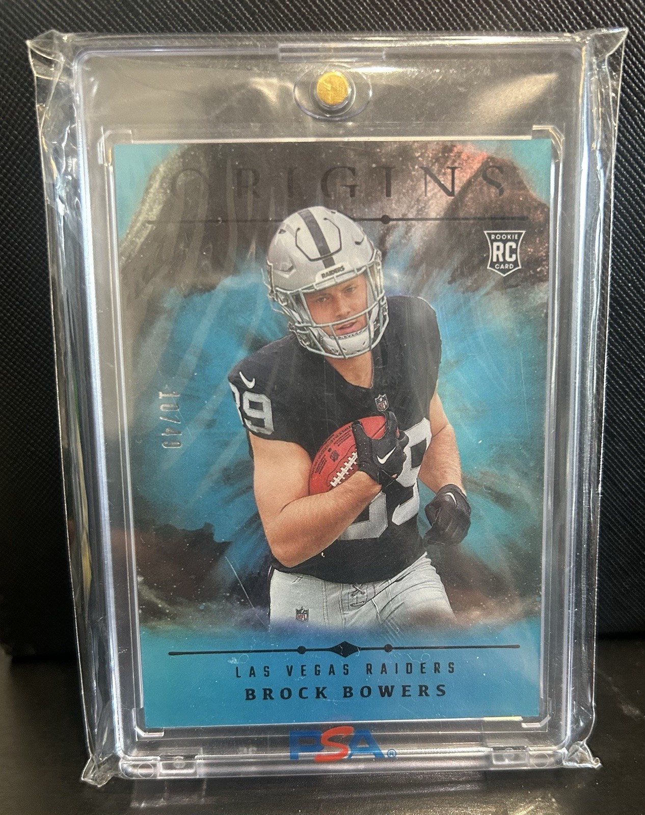 2024 Panini Origins - Rookies Brock Bowers #146 Holo Turquoise /49 (RC)