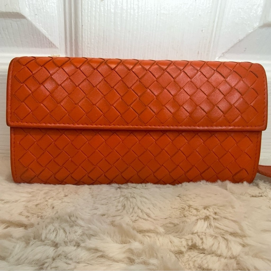 BOTTEGA VENETA INTRECCIATO CONTINENTAL LONG WALLET IN ORANGE