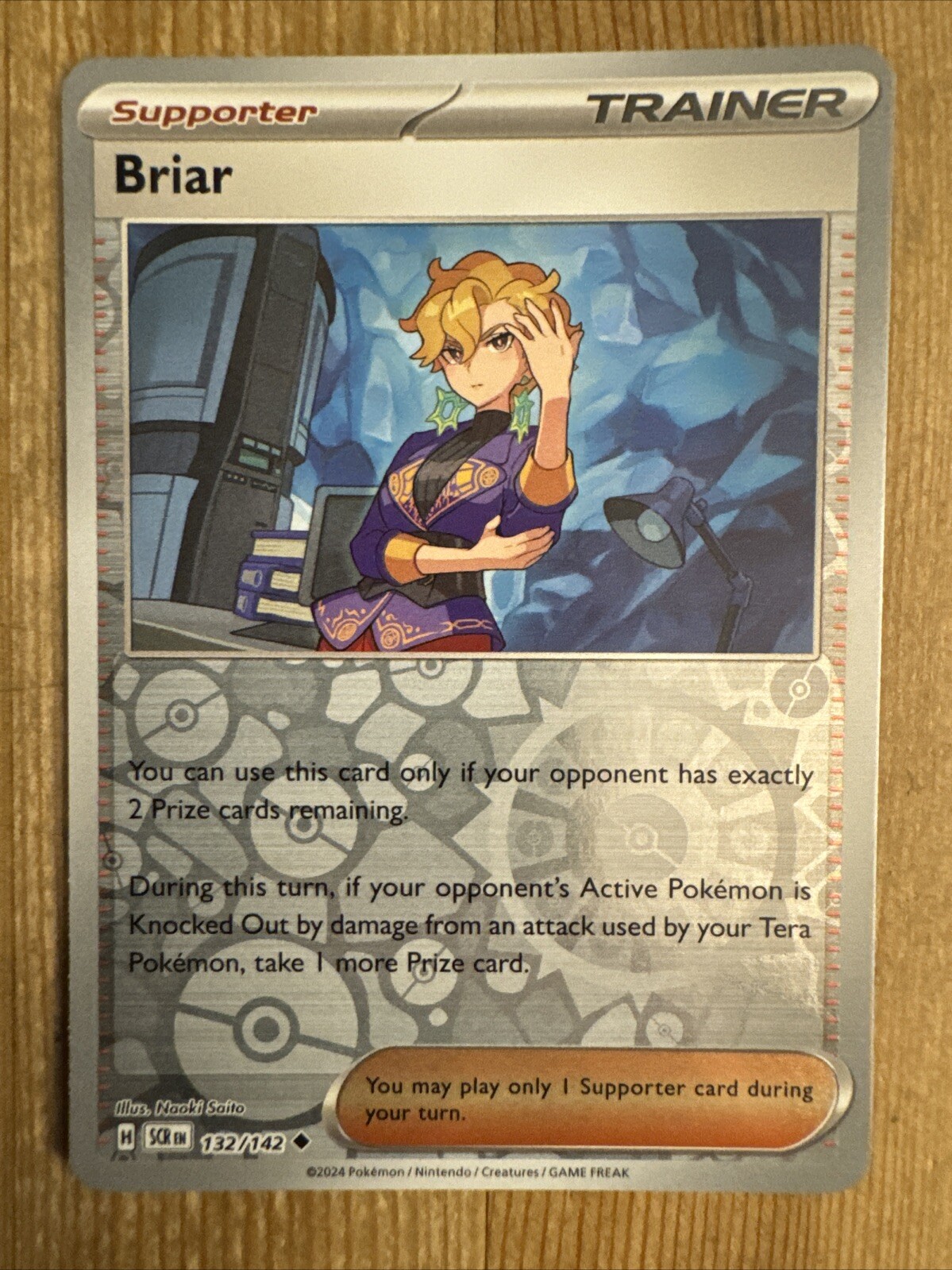 Briar 132/142 Stellar Crown Reverse Holo Pokemon Card NM