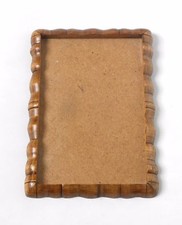 Handmade wooden photo frame on the wall