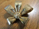 Vintage Miriam Haskell signed textured gold toned bow brooch pin