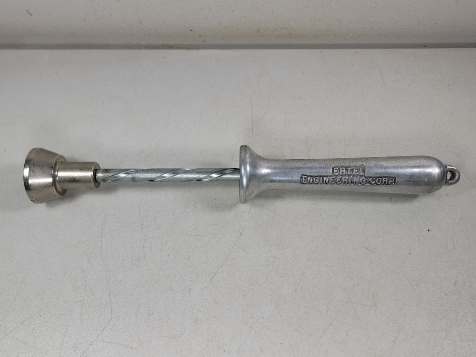 A mysterious aluminum twist drill gauge from a defunct NY engineering firm — the kind of oddball industrial artifact that looks great on a workshop shelf.