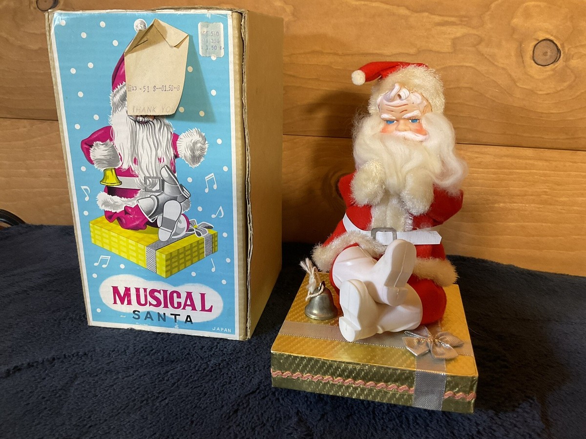 Vintage Kitschy grumpy Santa Claus sitting on present Japan 1950sn