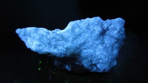 Powder Blue Fluorescent mineral rock with Flash Orange Phosphoresce T28