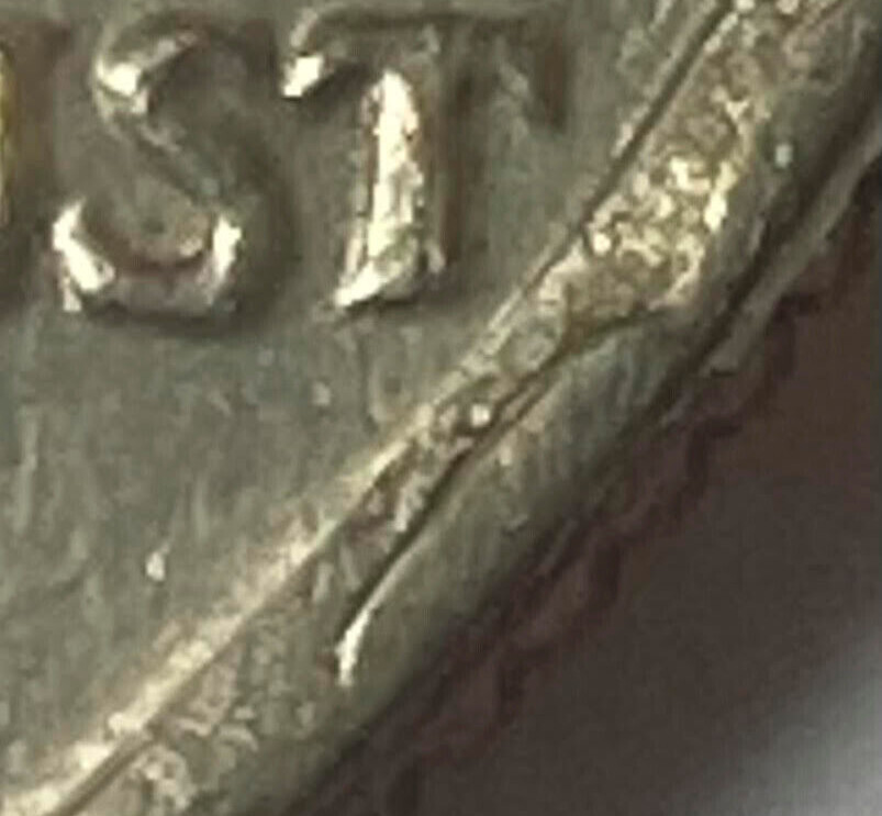 1972 Kennedy Half Dollar Error - Die break Kennedy's nose (looks