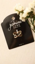 JASMINE LANE Gold Tone X Ring Size 7 Band
