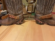 Tough 1 Bull riding Spurs with hand made straps. Rowels can be un locked.
