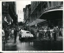 1977 Press Photo Boston, MA - Laborers gather at former Gilchrist's store.