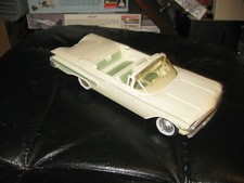 Vintage 1960 Chevrolet Impala Convertible Promo Car in white with blue trim