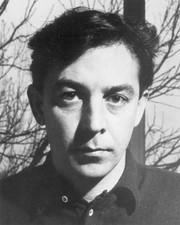 American writer Terry Southern standing outdoors in front of - 1950 Old Photo